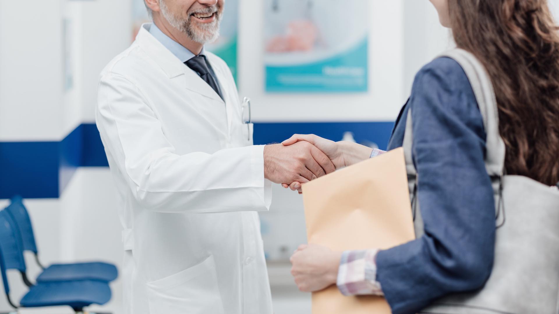 Doctor welcoming a patient at the clinic